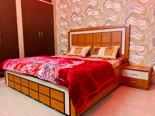 Postel nebo postele na pokoji v ubytování Hotel & BNB Solanki Residency Jaipur