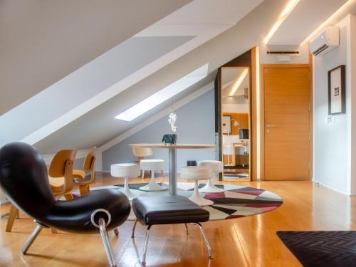 a living room with a table and chairs at Browns Downtown Hotel in Lisbon