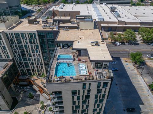 an overhead view of a building with a swimming pool at 2bd 2ba Best style and location Pool spa gym pkg! in American Towers Condominium