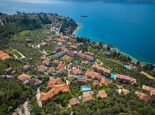 an aerial view of a town next to the water at Hotel Villa Smeralda in Malcesine