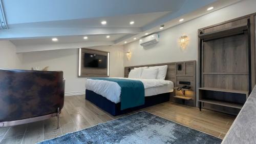 a hotel room with a bed and a television at Mona Bosphorus in Istanbul