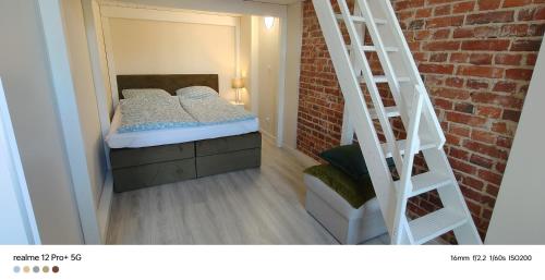 Ένα ή περισσότερα κρεβάτια σε δωμάτιο στο Apartament w Rynku