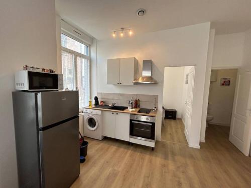 Η κουζίνα ή μικρή κουζίνα στο Entre Gare et Centre ville