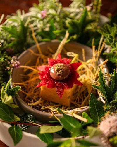 a plate of food with flowers on top of pasta at Palm House Boutique Hotel and Spa in Cape Town