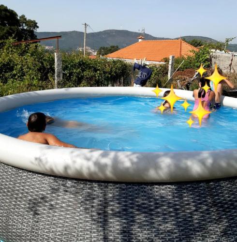 a man in a hot tub with stars in it at Casinha Nº461 in Vila Praia de Âncora