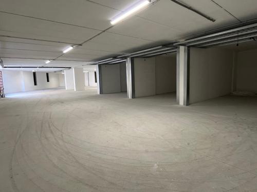 an empty room with a large concrete floor at Sotto le Mura, appartamento Mosaico in Siena