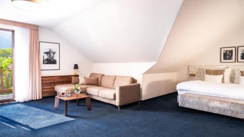 Postel nebo postele na pokoji v ubytování Hotel Savoy Špindlerův Mlýn