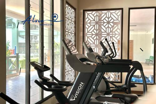 a gym with several cardio machines in front of a window at Costa Mahkota - 1min I Mahkota Parade Mall I Dataran Pahlawan I Mahkota Hospital in Melaka