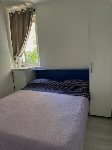 Posteľ alebo postele v izbe v ubytovaní Donilena