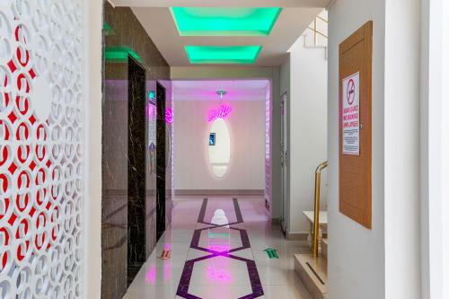 a hallway with pink and purple floors and a window at The Suites in Antalya