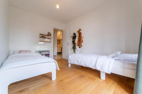 Ένα ή περισσότερα κρεβάτια σε δωμάτιο στο Le Duplex - Appartement 3 Chambres à Bordeaux