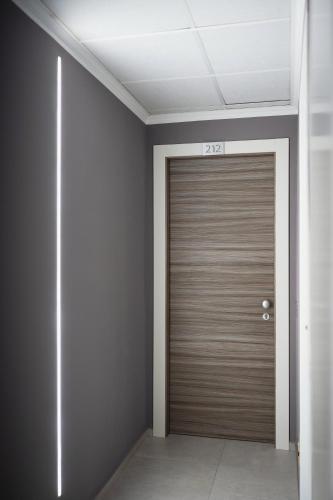a garage door in a room with a ceiling at Hotel Al Giardino in Treviso
