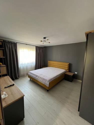 a bedroom with a bed and a window at Royal House in Canalu