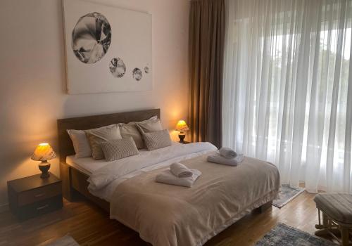 Giường trong phòng chung tại Muha ApartHotel