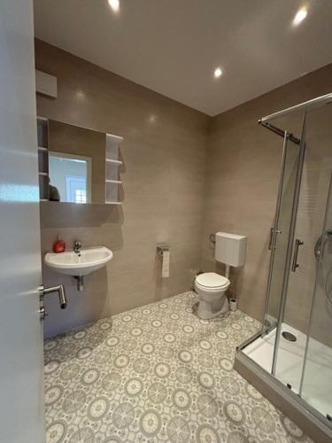 a bathroom with a toilet and a sink at Sala Monteur Apartment in Rodenbach