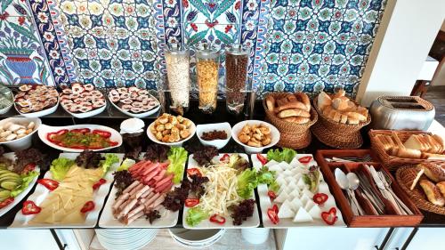 a buffet of different types of food on a table at Aldem Hotel in Istanbul