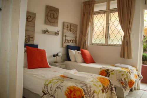 Ένα ή περισσότερα κρεβάτια σε δωμάτιο στο Driftsands uvongo