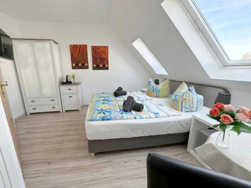 Ένα ή περισσότερα κρεβάτια σε δωμάτιο στο Hotel Nordlicht