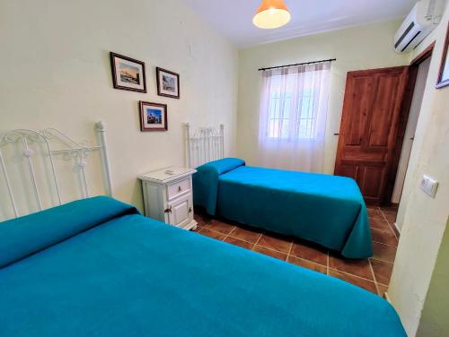 Postel nebo postele na pokoji v ubytování El Oasis de Castil