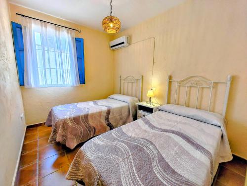 Postel nebo postele na pokoji v ubytování El Oasis de Castil