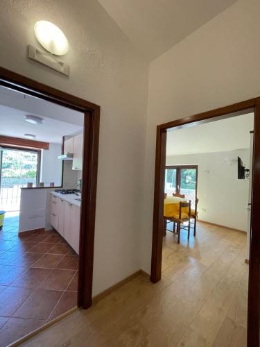 a room with a kitchen and a dining room at Greenlove in Agerola