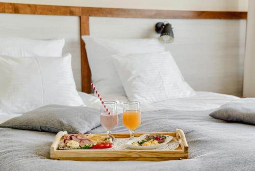 Ένα ή περισσότερα κρεβάτια σε δωμάτιο στο Hotel Półwysep Wądzyn