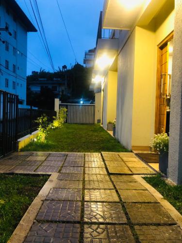 a walkway outside of a building at night at R21 Nuwara Eliya in Nuwara Eliya