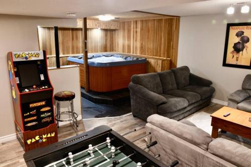 a living room with a pool table and a game room at Cozy, 4 Bedroom Chalet, 10 min walk to Village in Blue Mountains