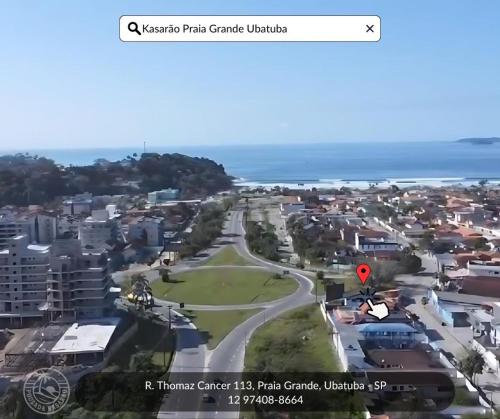 an aerial view of a town with a street at Pousada Kasarão Praia Grande Ubatuba in Ubatuba
