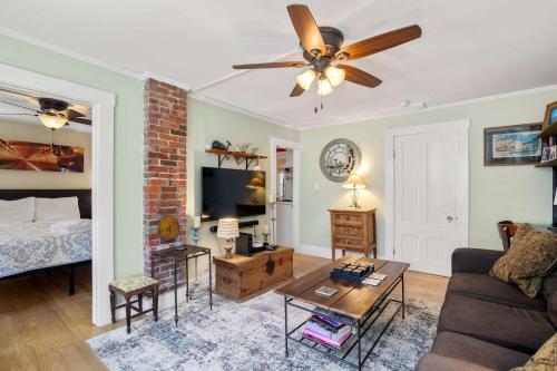 a living room with a couch and a ceiling fan at Steps to Commercial St Walk to Beach in Provincetown