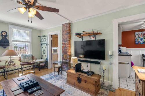 a living room with a flat screen tv at Steps to Commercial St Walk to Beach in Provincetown