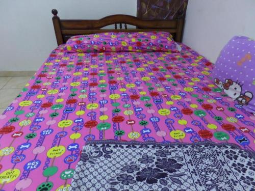 a pink bed with a hello kitty comforter on it at برج بيلو بيتش in Alexandria