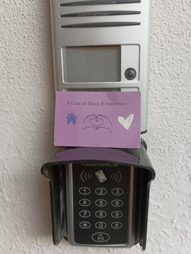 a cell phone with a box on top of it at A casa di Elena e Francesco in Bernalda