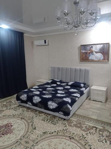 En eller flere senge i et værelse på VIP 3 Квартира 2ком большая