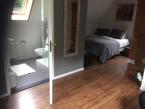 Ένα ή περισσότερα κρεβάτια σε δωμάτιο στο Wendrik Hoeve Bed & Stables