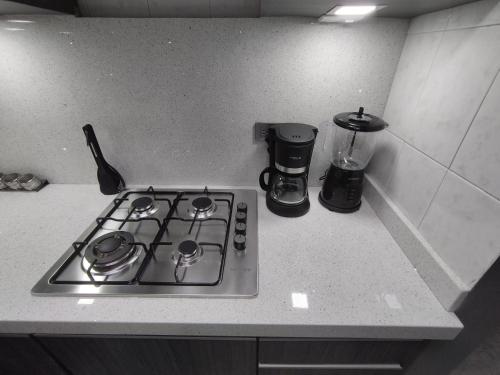a stove top oven sitting on top of a kitchen counter at Apartamento de lujo en Valencia 2 in Valencia