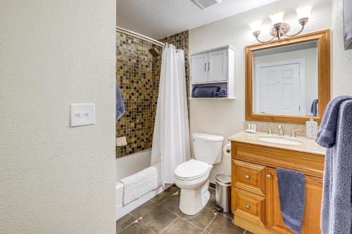 a bathroom with a toilet and a sink and a shower at Bremerton Home with Fire Pit Near Parks and Museums in Bremerton