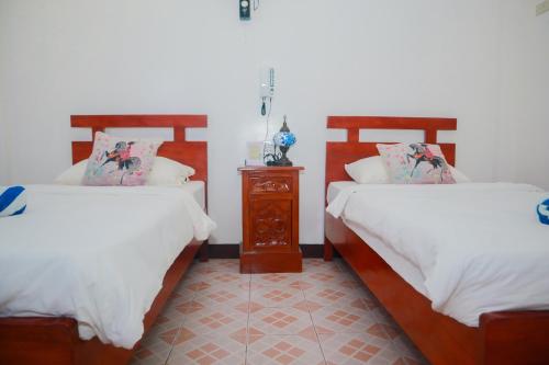 Katil atau katil-katil dalam bilik di Olana Bed and Breakfast