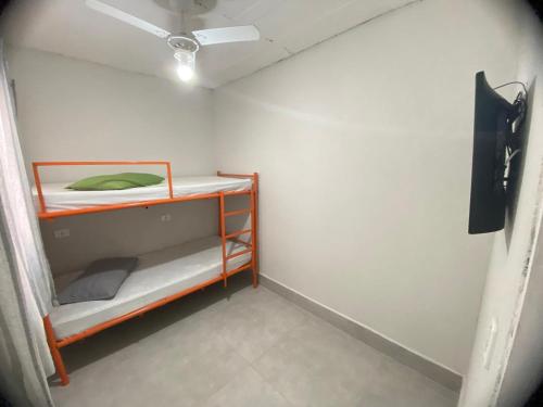 Katil atau katil-katil dalam bilik di Hostel Gravatá
