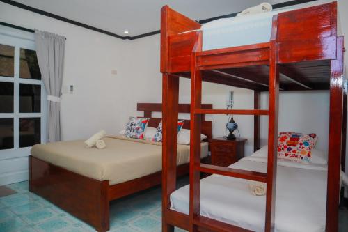 Katil atau katil-katil dalam bilik di Olana Bed and Breakfast