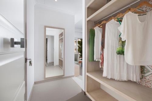 a dressing room with a mirror and a closet at Camalù Sorrento in Sorrento
