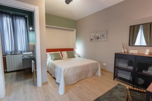 Postel nebo postele na pokoji v ubytování Arci Loft