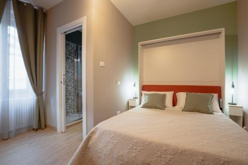 Postel nebo postele na pokoji v ubytování Arci Loft