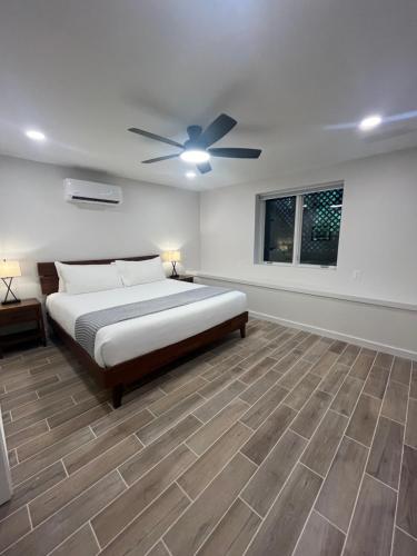 a bedroom with a bed and a ceiling fan at The Wells Cashiers in Cashiers