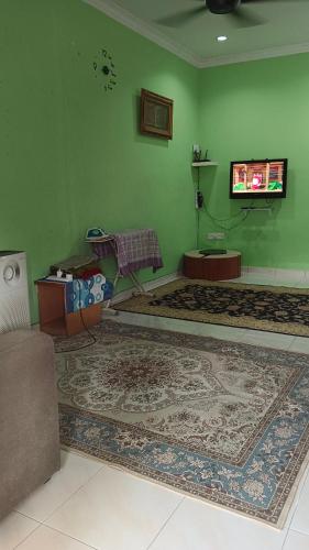 Televisyen dan/atau pusat hiburan di Homestay d'Tempinis