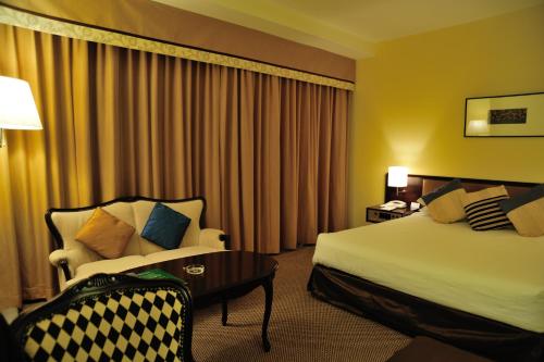 מיטה או מיטות בחדר ב-Hotel New Otani Nagaoka
