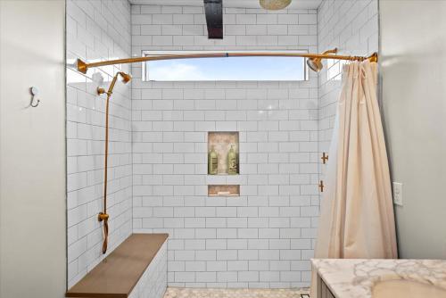 a bathroom with a shower with a shower curtain at Fantastic Family Home in Central Mount Washington in Pittsburgh