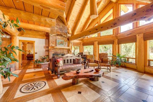 a large living room with a large wooden ceiling at Scenic Payson Cabin with Wraparound Patio in Payson