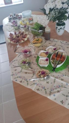 a table with many plates of food on it at Zur Schlinge in Siebenhitz