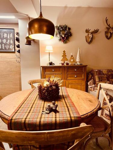 a dining room table with a bowl on top of it at La casa di Teo Pescocostanzo in Pescocostanzo